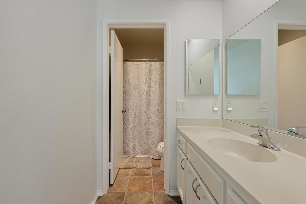 8612 Arminda Circle, Unit 51 Santee, CA 92071 - Photo 35 of 55 a bathroom with a sink a toilet and shower