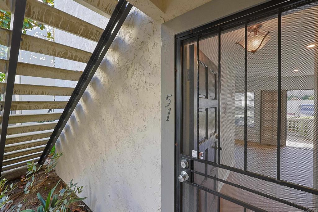 8612 Arminda Circle, Unit 51 Santee, CA 92071 - Photo 41 of 55 a view of an entryway with a floor to ceiling window