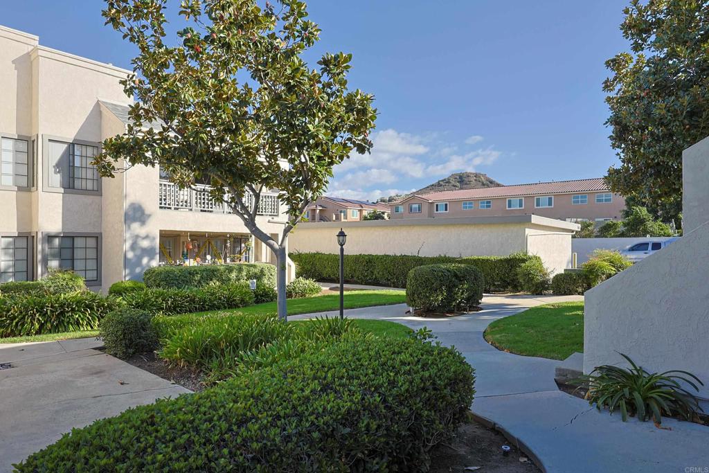 8612 Arminda Circle, Unit 51 Santee, CA 92071 - Photo 48 of 55 a view of a big house with a big yard and potted plants