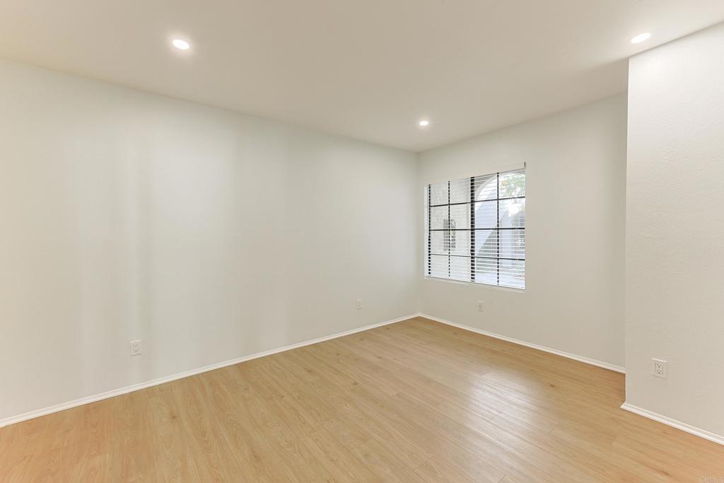 8612 Arminda Circle, Unit 51 Santee, CA 92071 - Photo 8 of 55 an empty room with wooden floor and windows