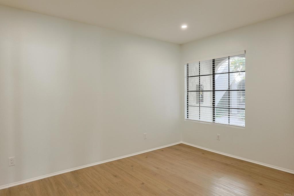 8612 Arminda Circle, Unit 51 Santee, CA 92071 - Photo 9 of 55 an empty room with wooden floor and windows