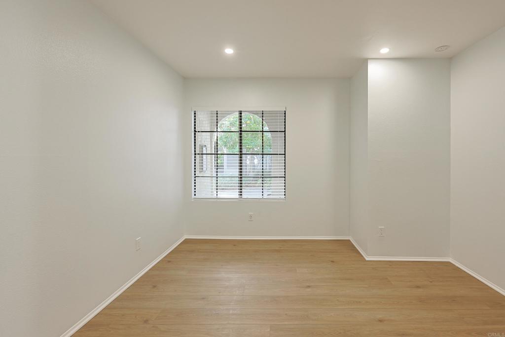 8612 Arminda Circle, Unit 51 Santee, CA 92071 - Photo 10 of 55 an empty room with wooden floor and windows