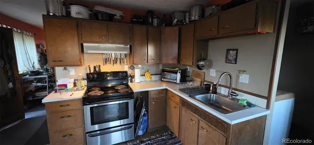 a kitchen with a stove and a sink
