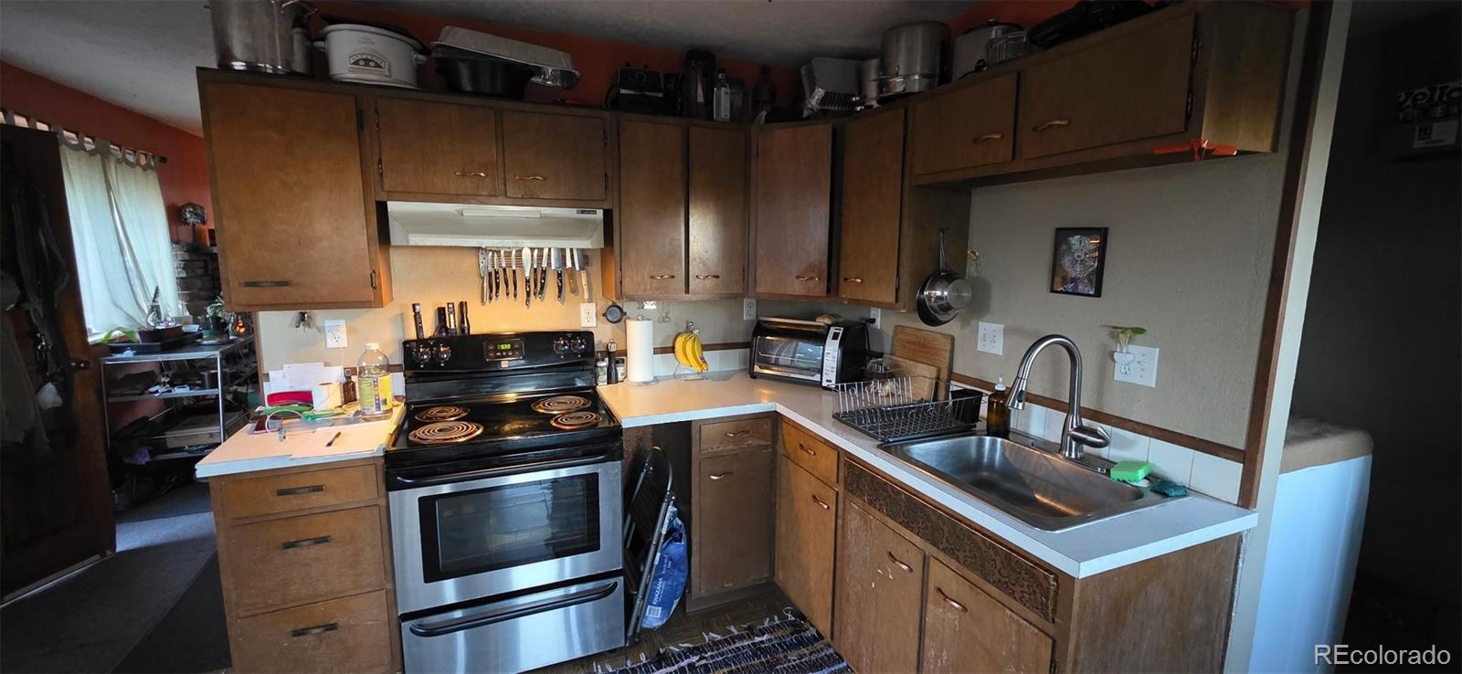 87 Circle Road Golden, CO 80403 - Photo 4 of 15 a kitchen with a stove and a sink