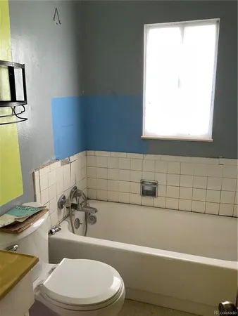 a bathroom with a sink a toilet and a bathtub