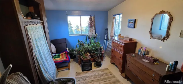 a room with furniture and a mirror