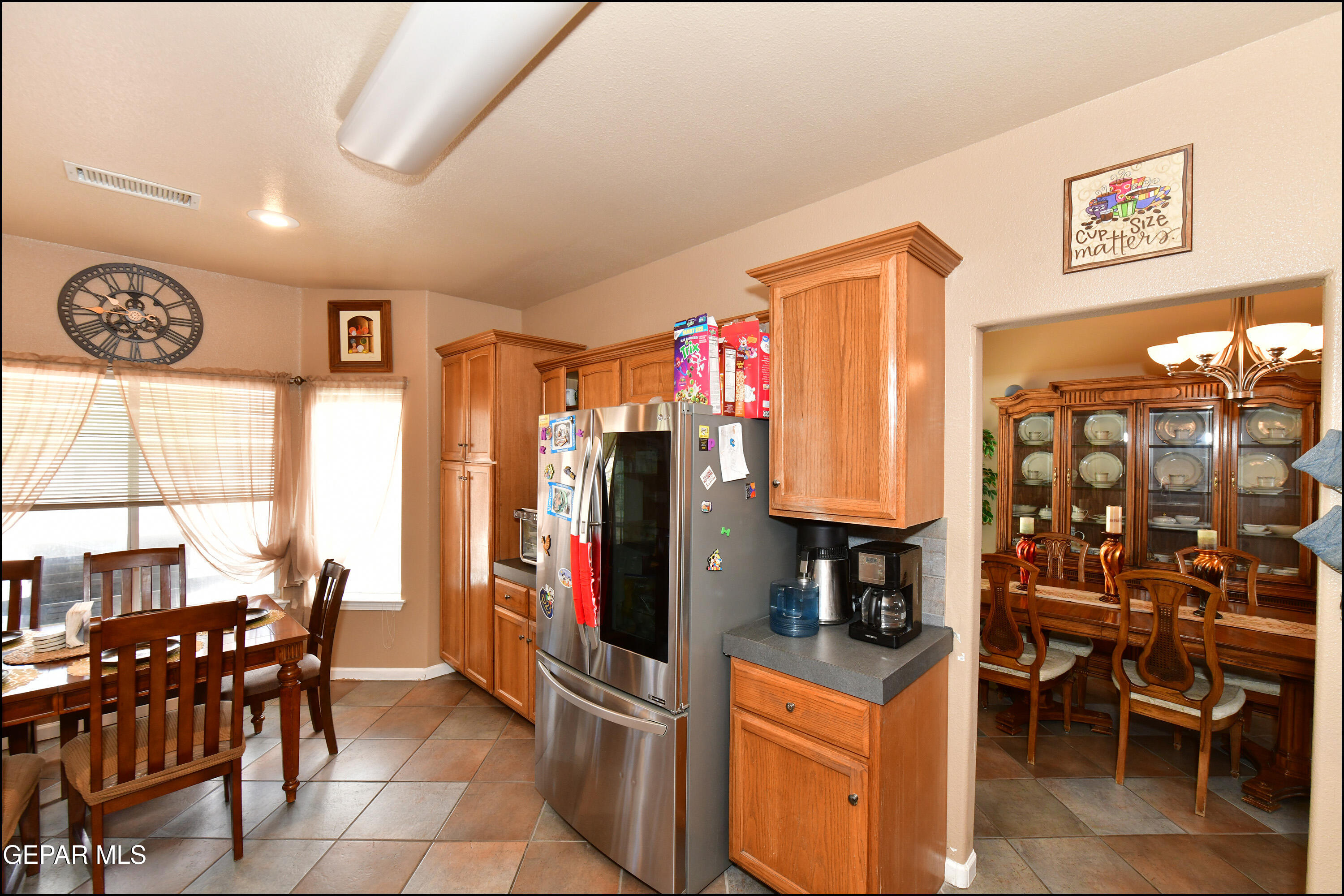 7350 Navidad Way Canutillo, TX 79835 - Photo 15 of 49 a view of a dining room with furniture and a chandelier