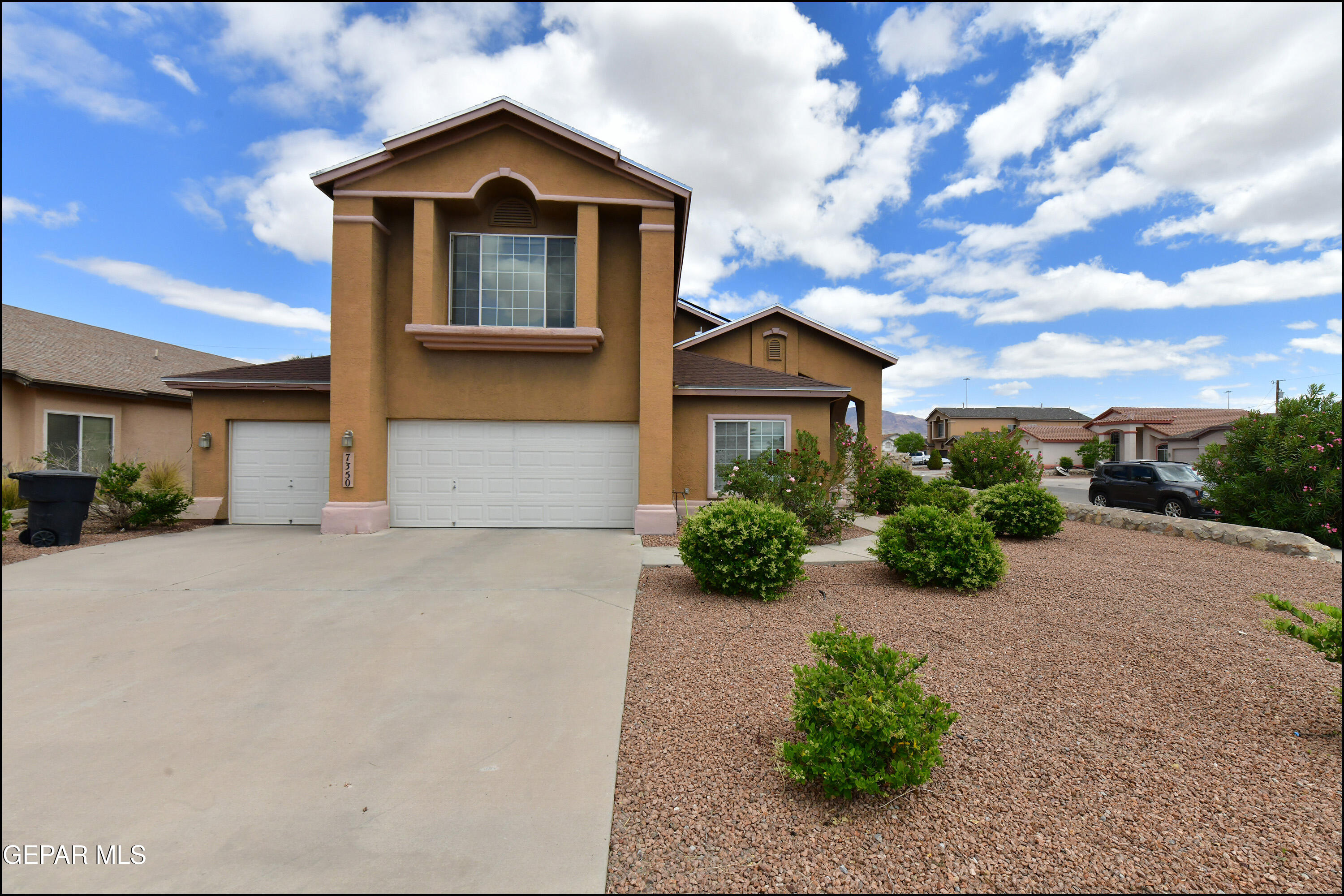 7350 Navidad Way Canutillo, TX 79835 - Photo 2 of 49 a front view of a house with a yard