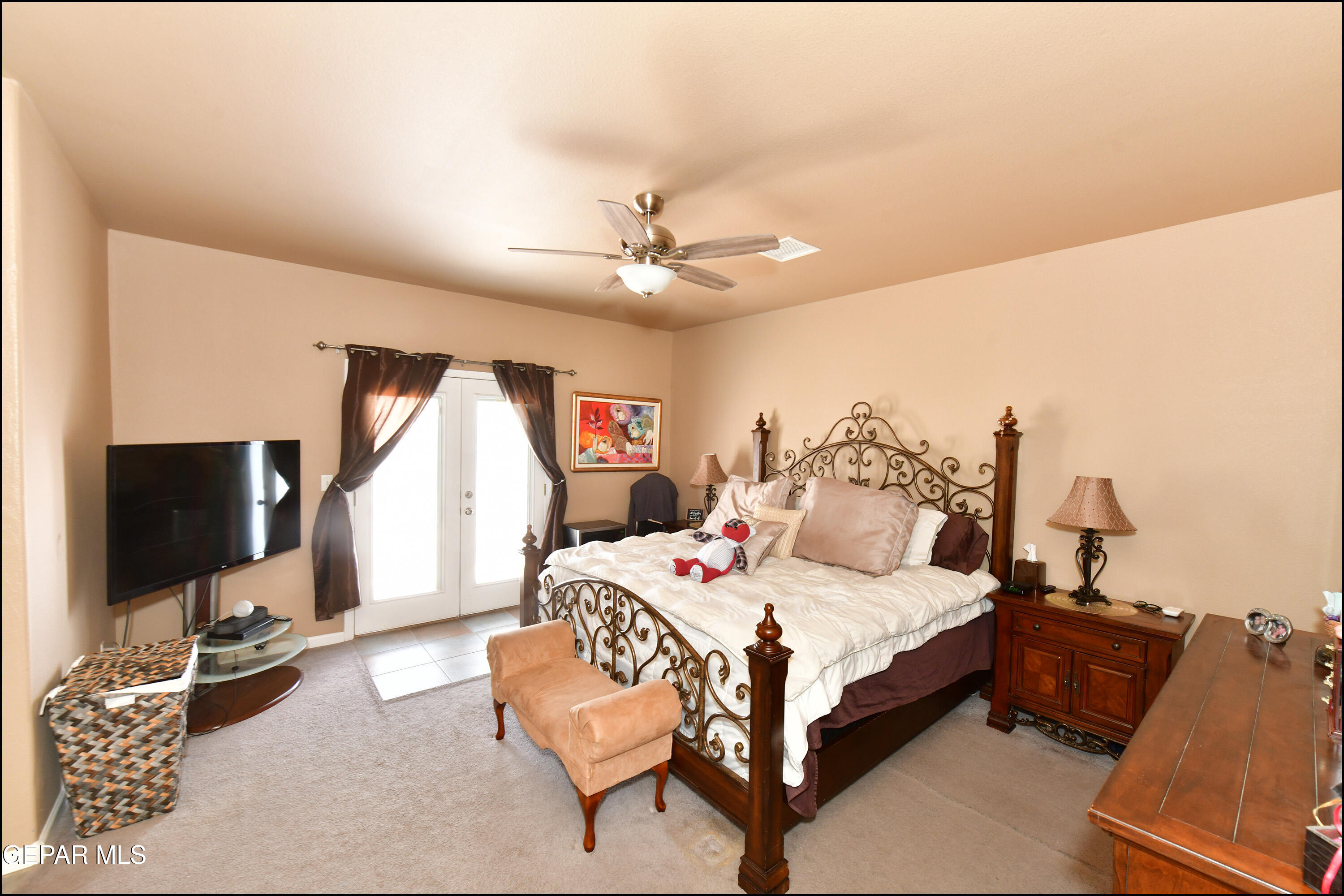 7350 Navidad Way Canutillo, TX 79835 - Photo 24 of 49 a bedroom with a bed and a flat screen tv