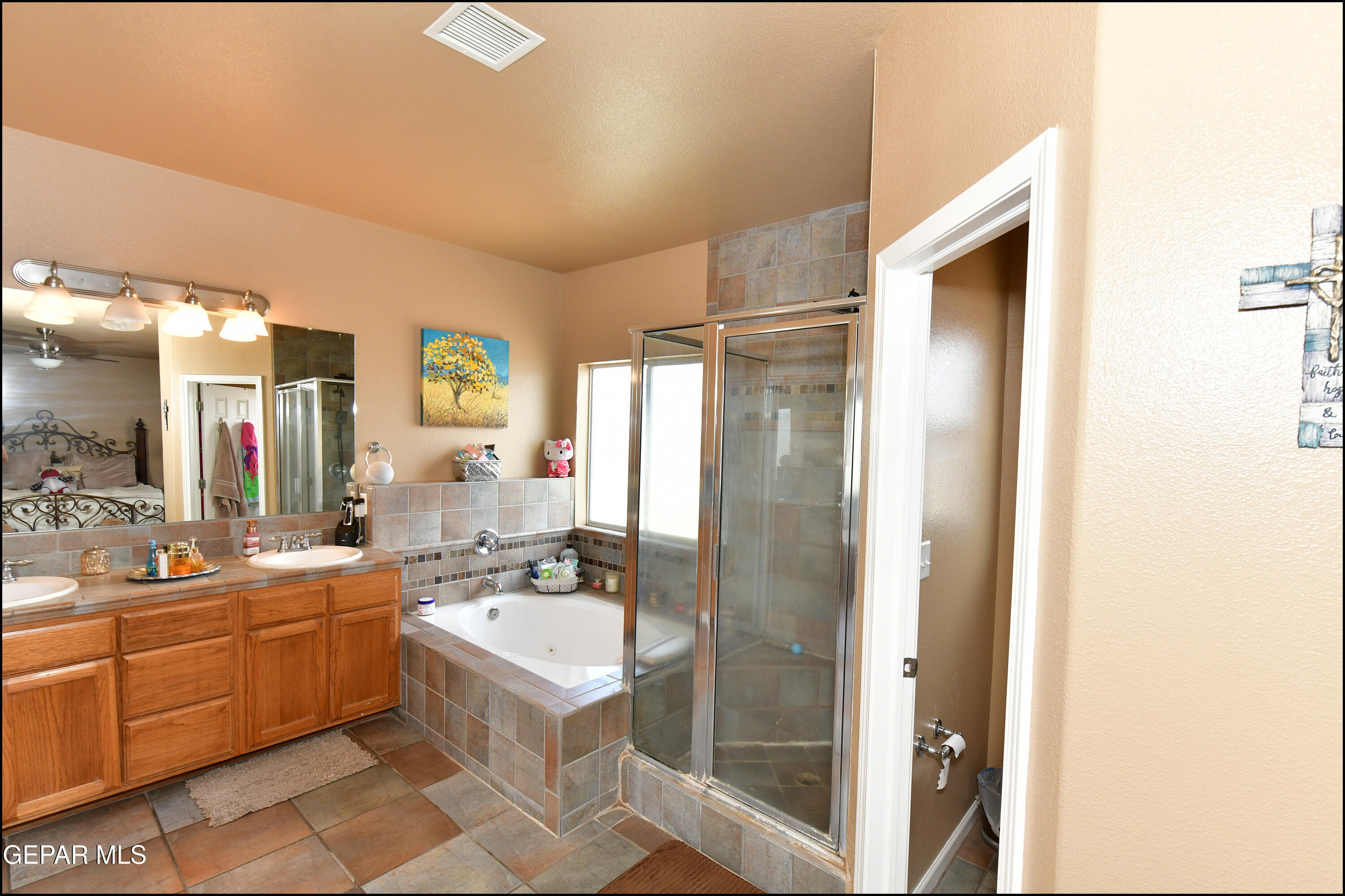 7350 Navidad Way Canutillo, TX 79835 - Photo 27 of 49 a bathroom with a double vanity sink mirror and shower