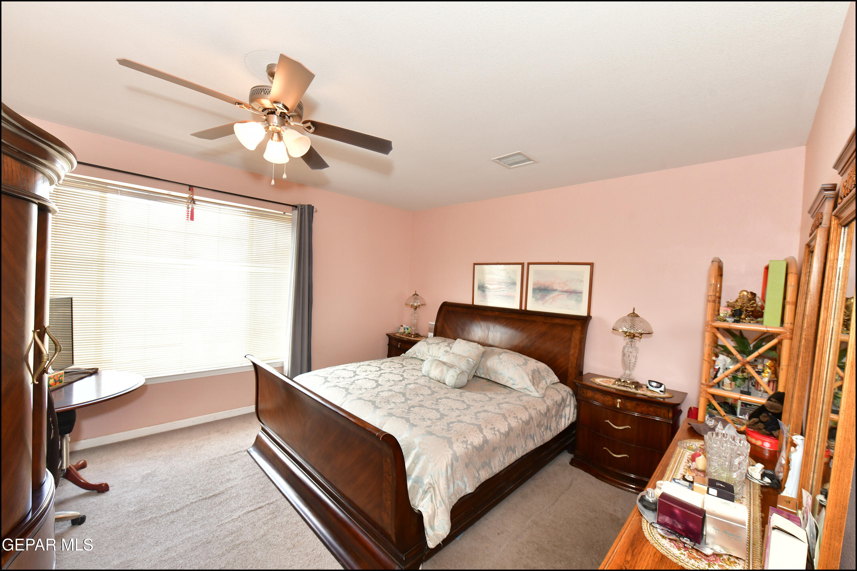 7350 Navidad Way Canutillo, TX 79835 - Photo 32 of 49 a bedroom with a bed and a chandelier