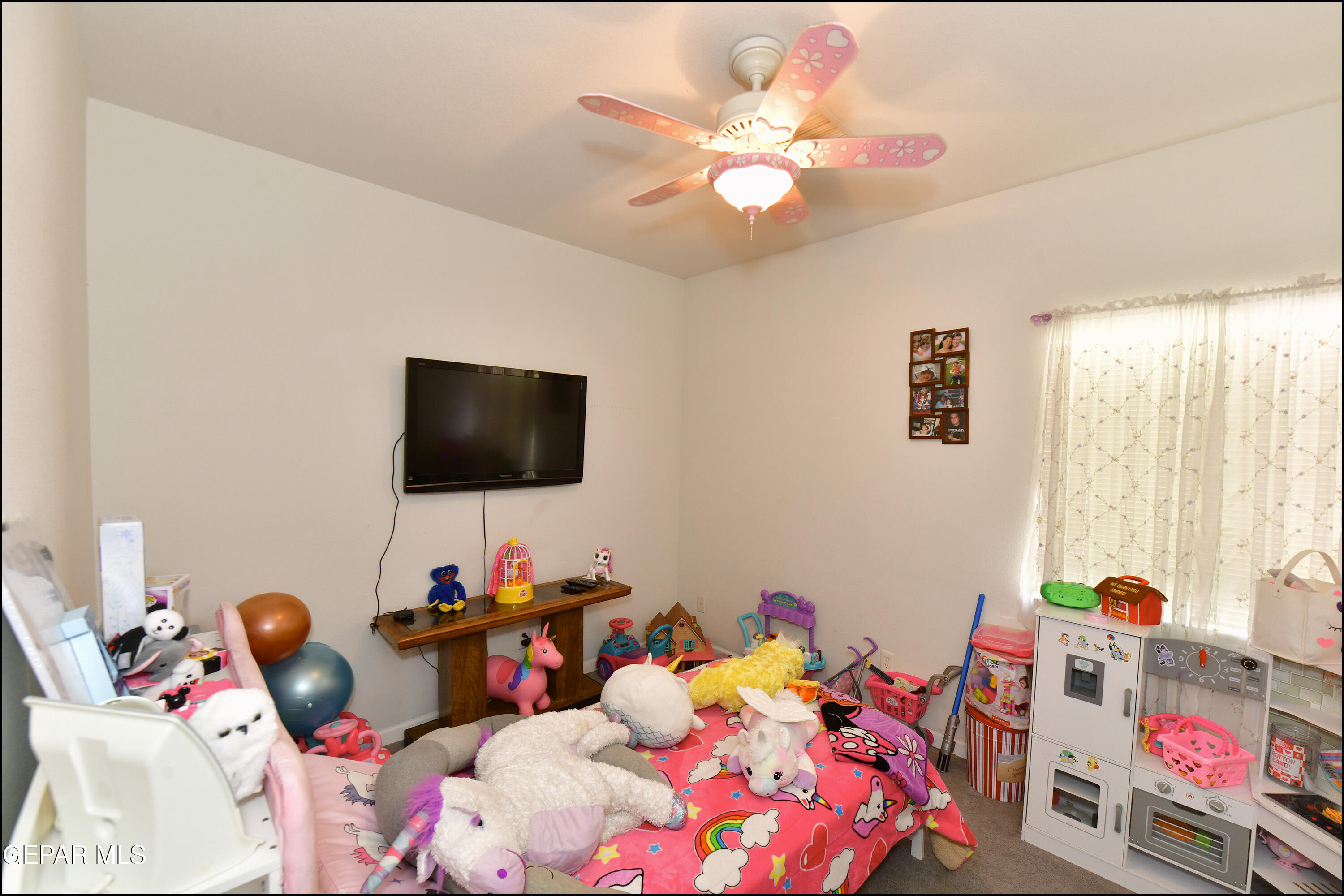 7350 Navidad Way Canutillo, TX 79835 - Photo 34 of 49 a bedroom with a bed and a flat screen tv