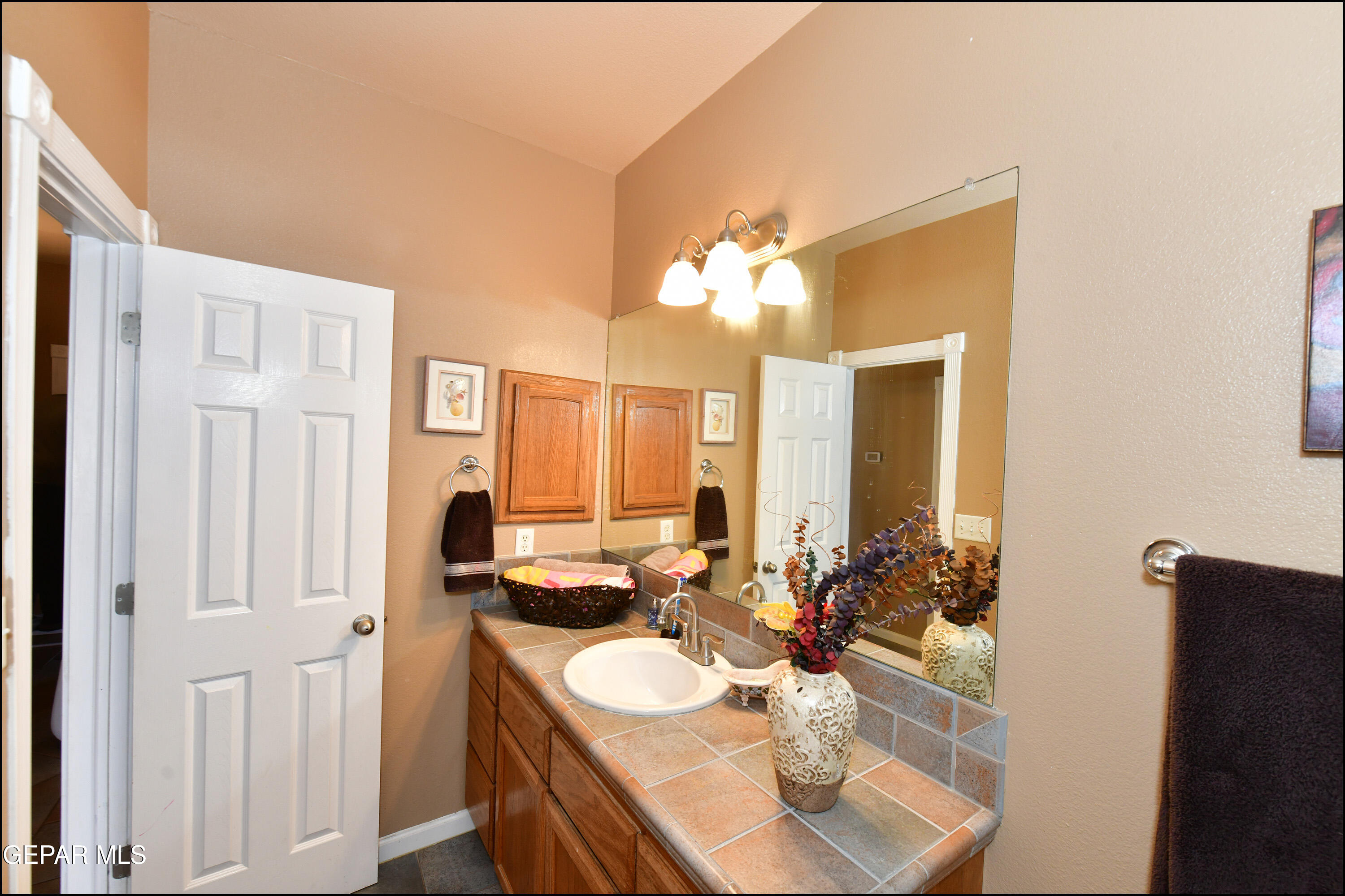 7350 Navidad Way Canutillo, TX 79835 - Photo 36 of 49 a bathroom with a double vanity sink and a mirror