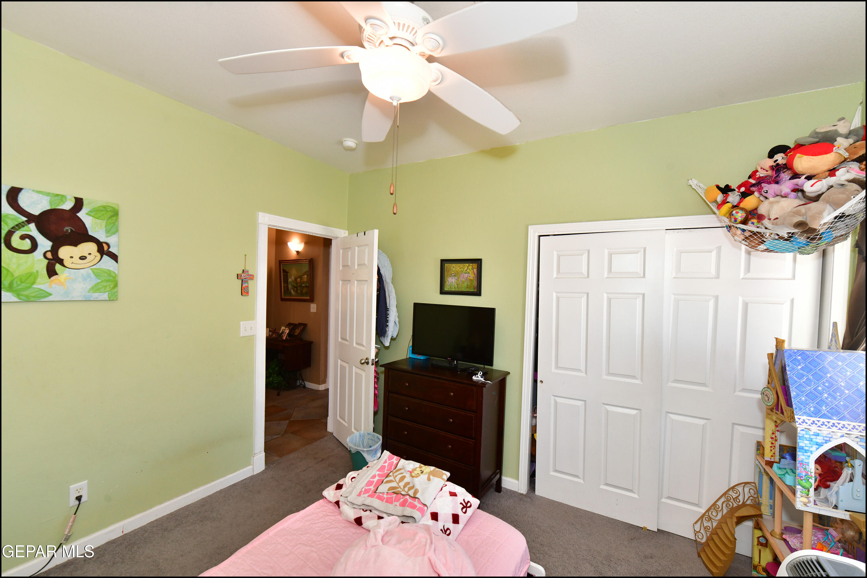 7350 Navidad Way Canutillo, TX 79835 - Photo 39 of 49 a bedroom with a bed and a chandelier