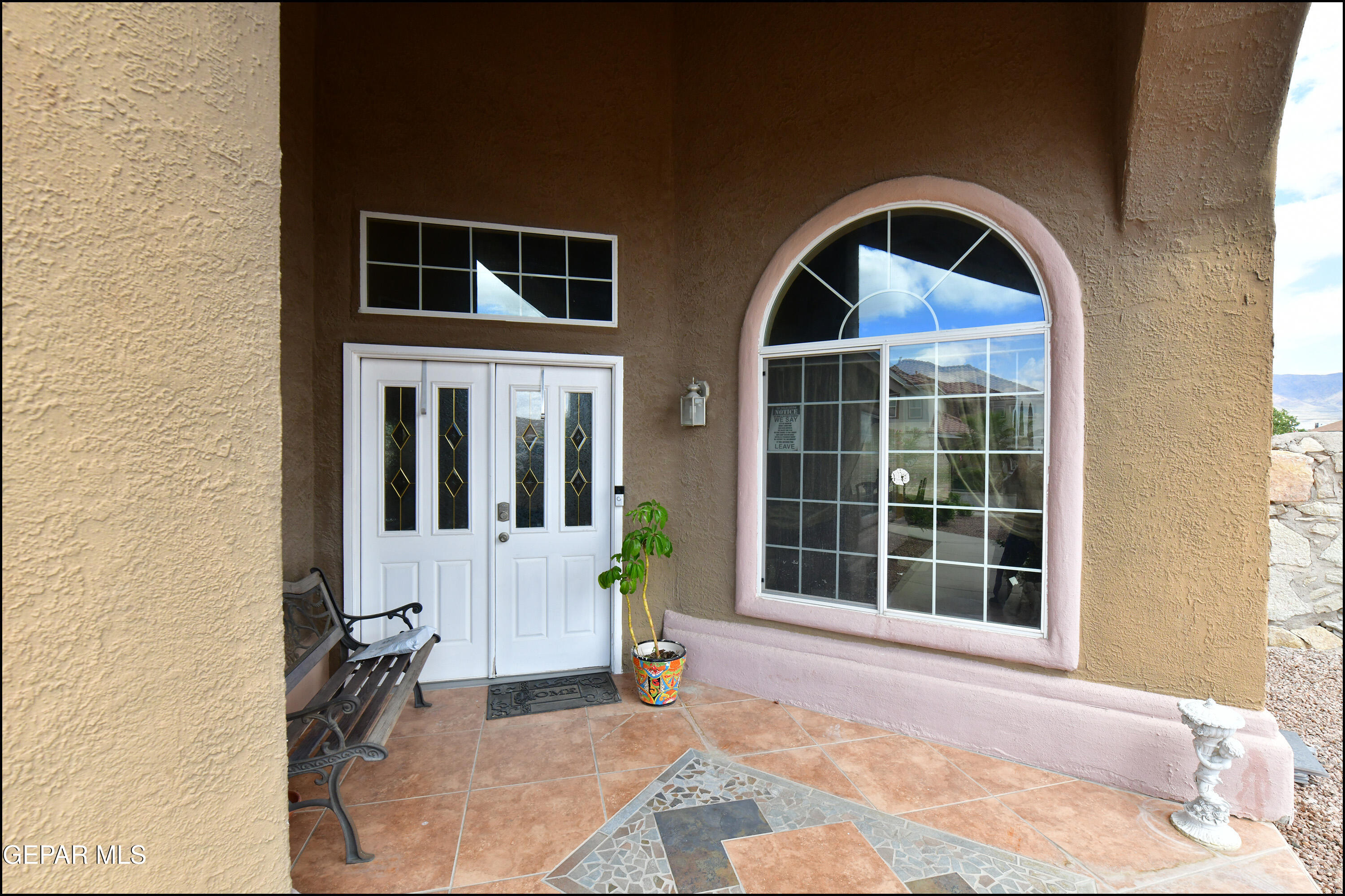 7350 Navidad Way Canutillo, TX 79835 - Photo 4 of 49 a front view of a house with a large window