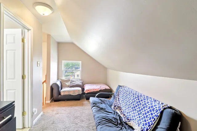 a bedroom with furniture and a window