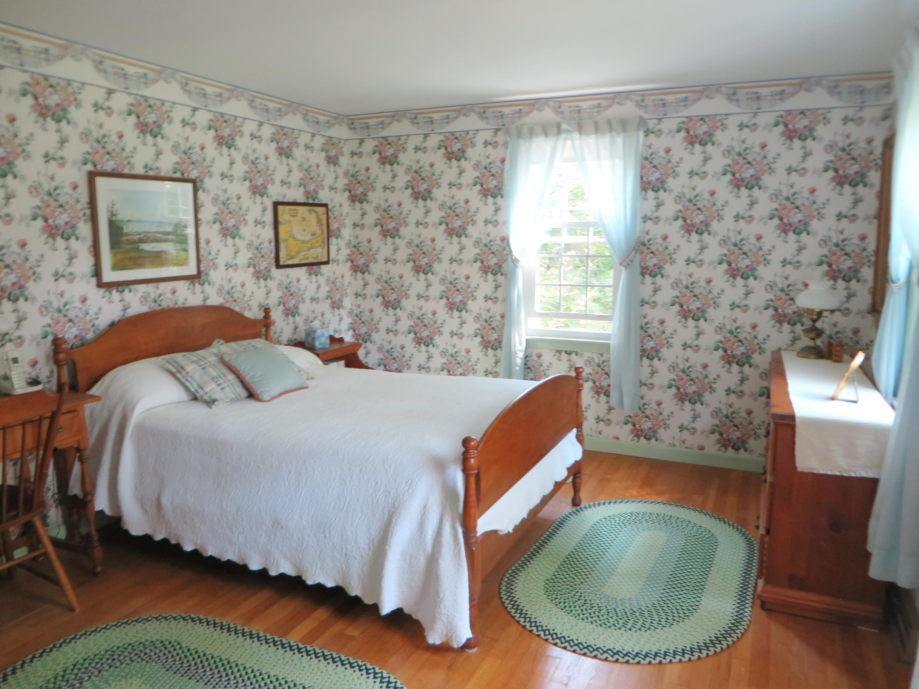 51 Monomoy Road Harwich Port, MA 02646 - Photo 11 of 19 a bedroom with a bed and chair