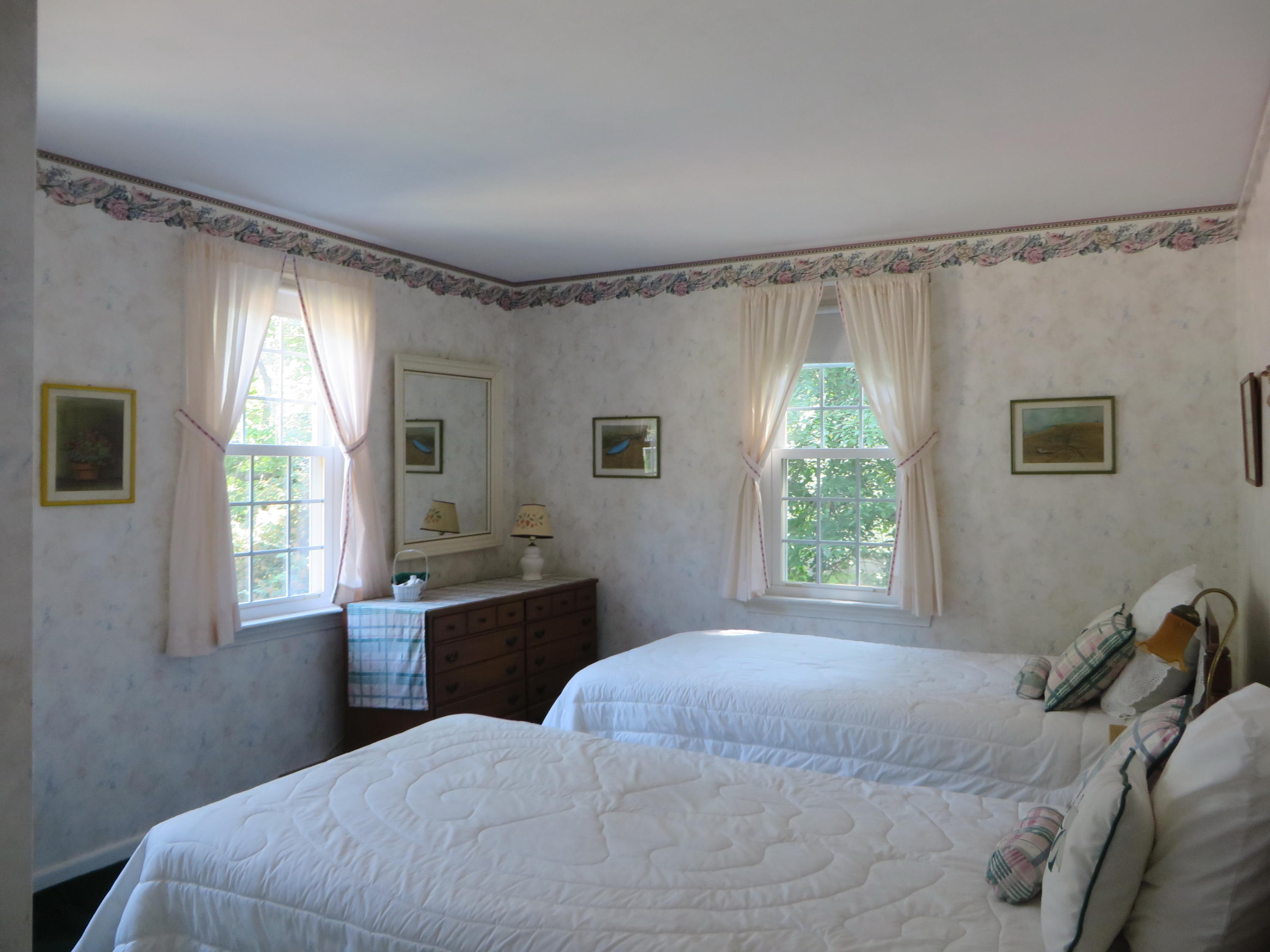 51 Monomoy Road Harwich Port, MA 02646 - Photo 13 of 19 a bedroom with a bed and a window