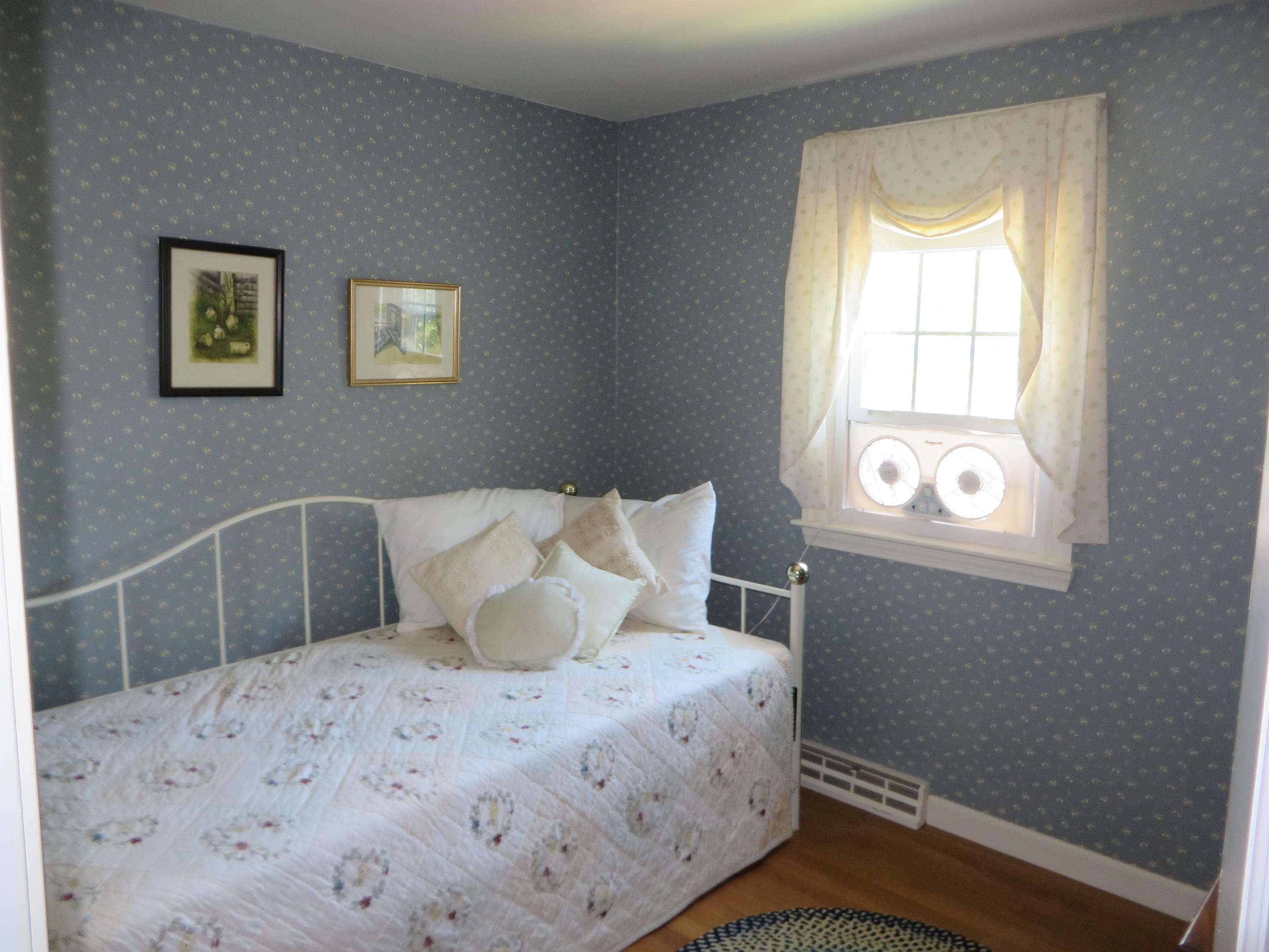 51 Monomoy Road Harwich Port, MA 02646 - Photo 15 of 19 a bedroom with a bed and a window