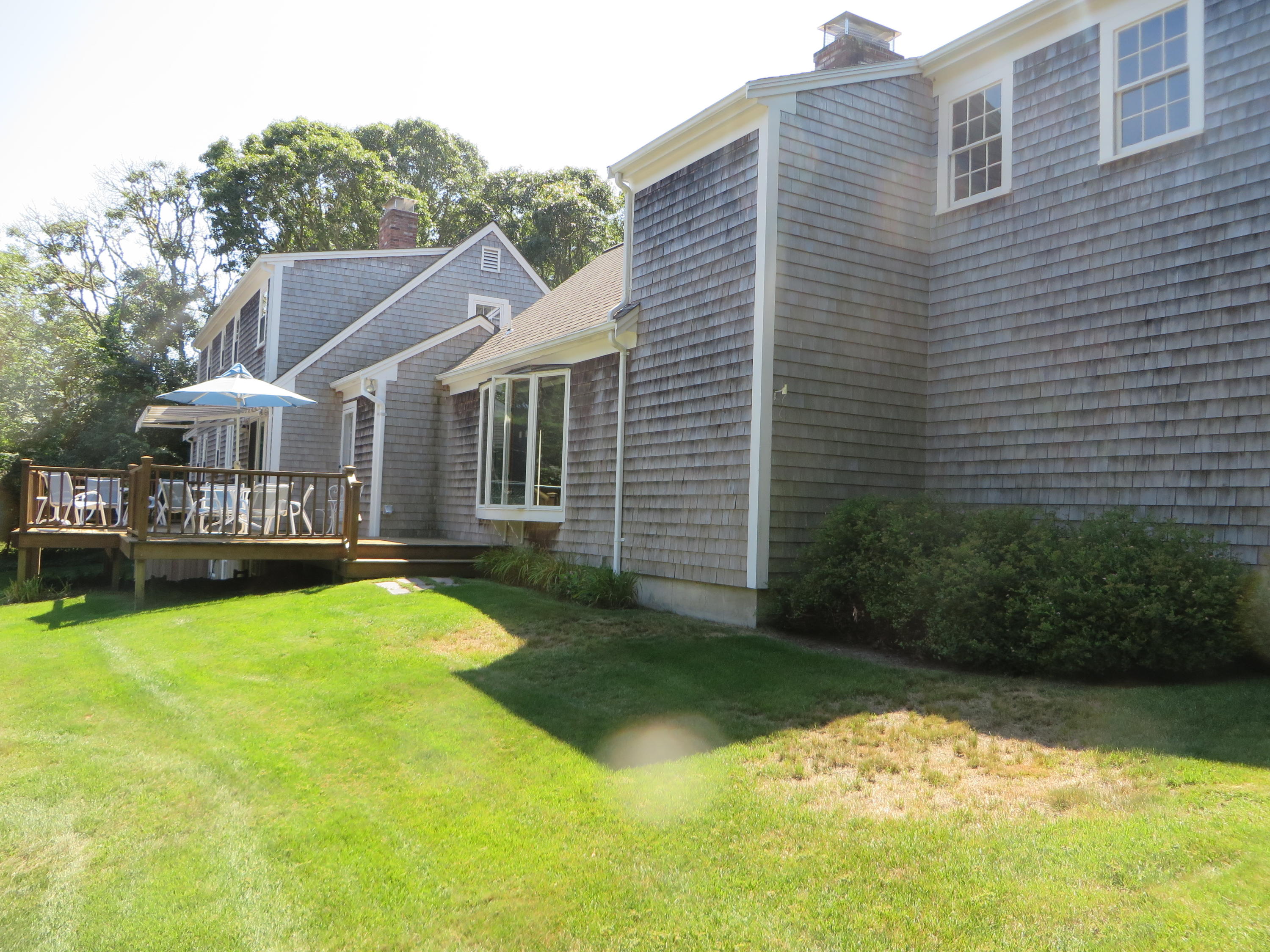 51 Monomoy Road Harwich Port, MA 02646 - Photo 2 of 19 a view of a house with swimming pool and sitting area