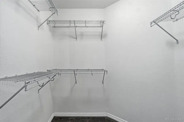 a view of a room with racks on the wall