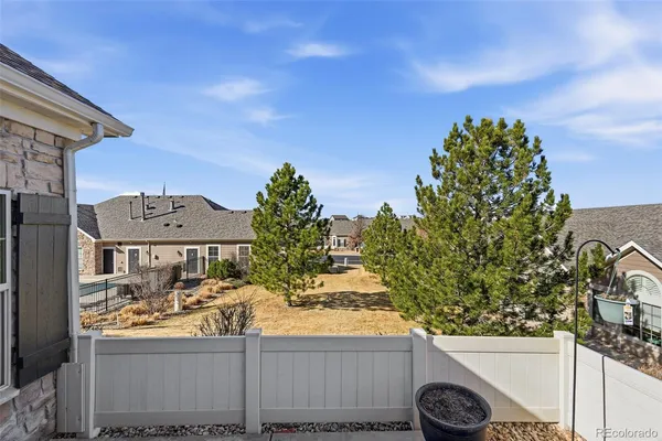 a view of a patio with a table and chairs