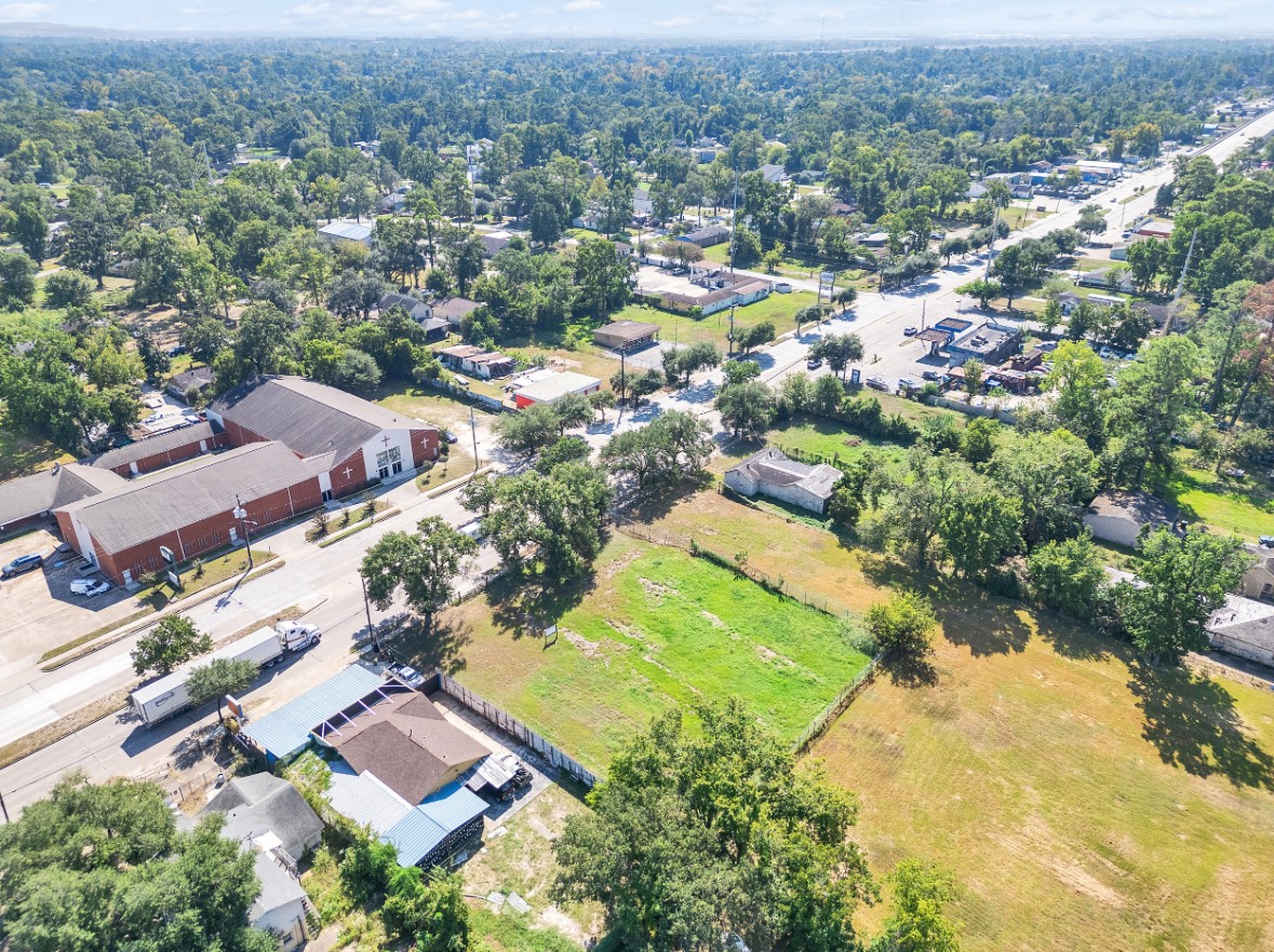 an aerial view of residential houses with outdoor space