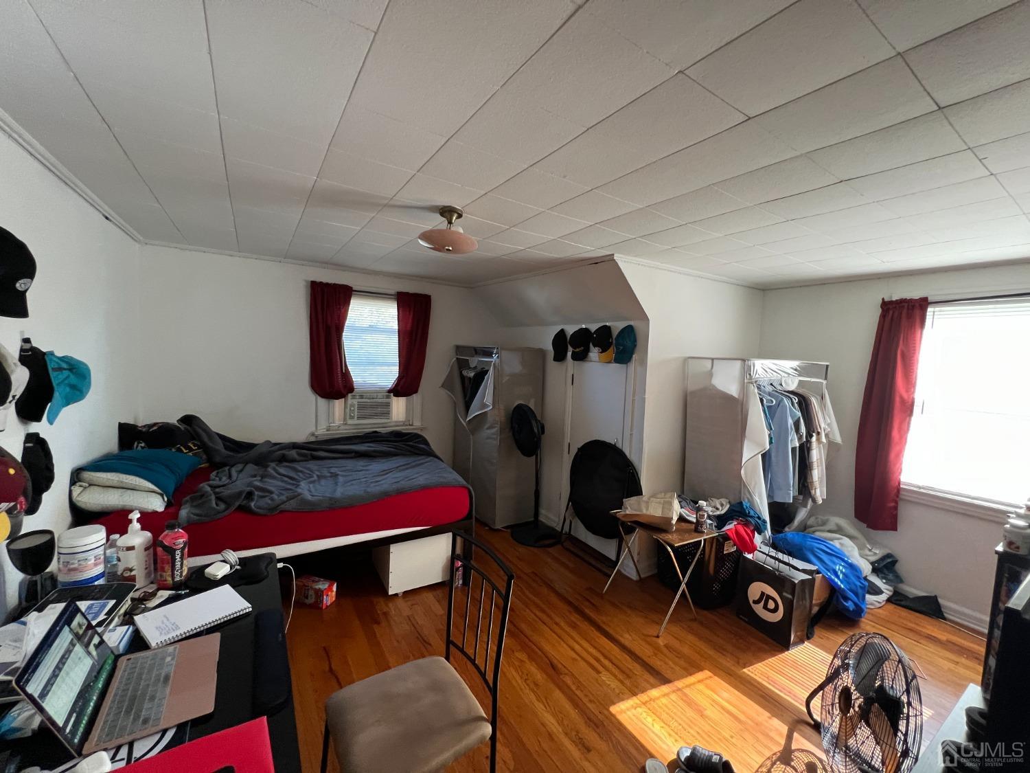 48 Riverview Avenue Edison, NJ 08817 - Photo 19 of 19 a bed room with furniture and a gym machine