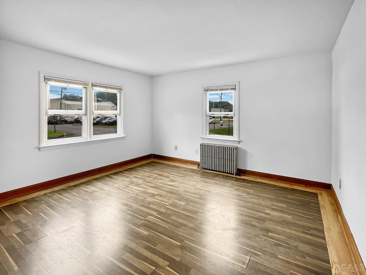 48 Riverview Avenue Edison, NJ 08817 - Photo 3 of 19 a view of empty room with wooden floor and fan