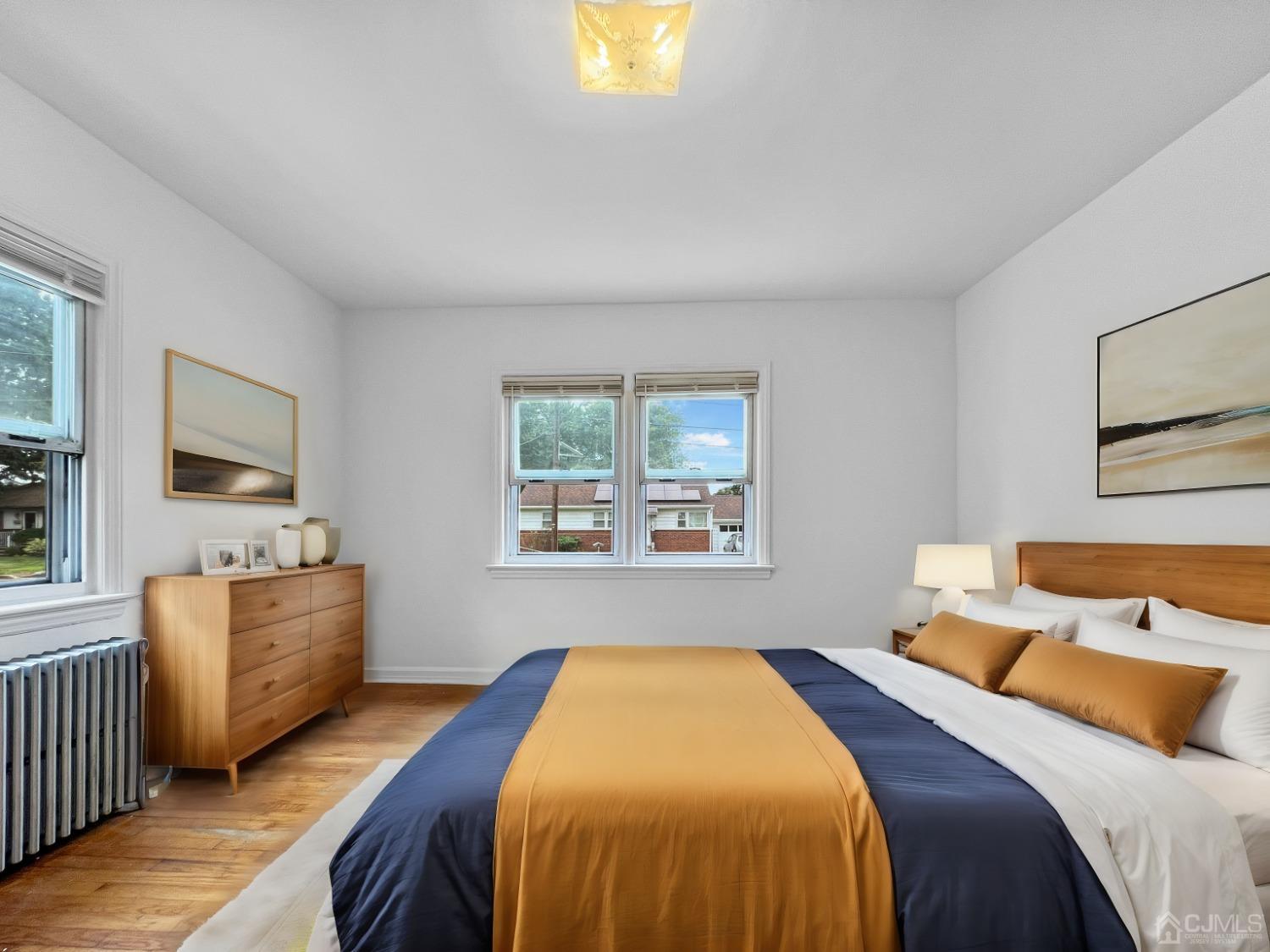 48 Riverview Avenue Edison, NJ 08817 - Photo 6 of 19 a bedroom with a bed and a windows