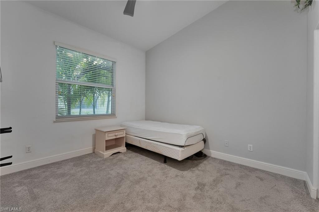 15322 Cortona Way Naples, FL 34120 - Photo 11 of 26 an empty room with a window
