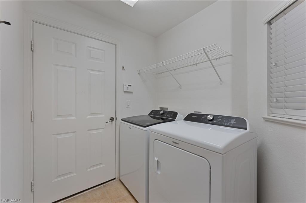 15322 Cortona Way Naples, FL 34120 - Photo 13 of 26 a utility room with dryer and washer