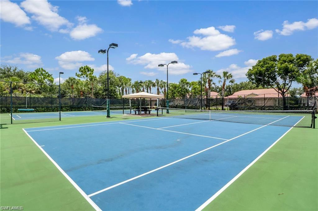 15322 Cortona Way Naples, FL 34120 - Photo 17 of 26 a view of a tennis court