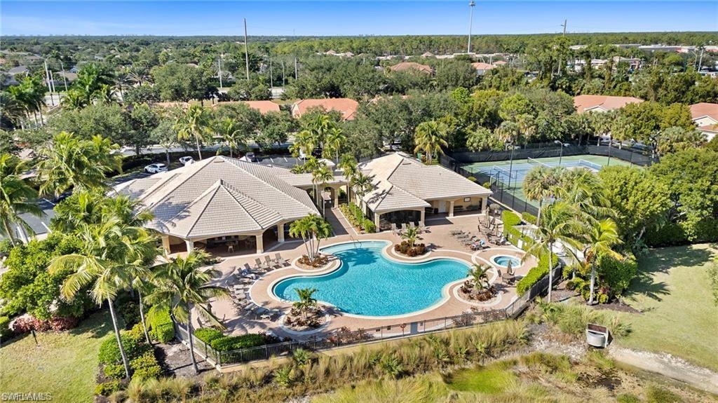 15322 Cortona Way Naples, FL 34120 - Photo 21 of 26 an aerial view of a house with garden space and street view
