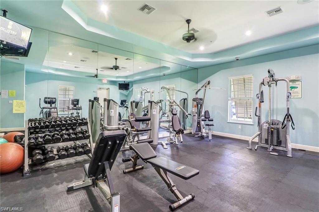 15322 Cortona Way Naples, FL 34120 - Photo 23 of 26 a view of a room with gym equipment
