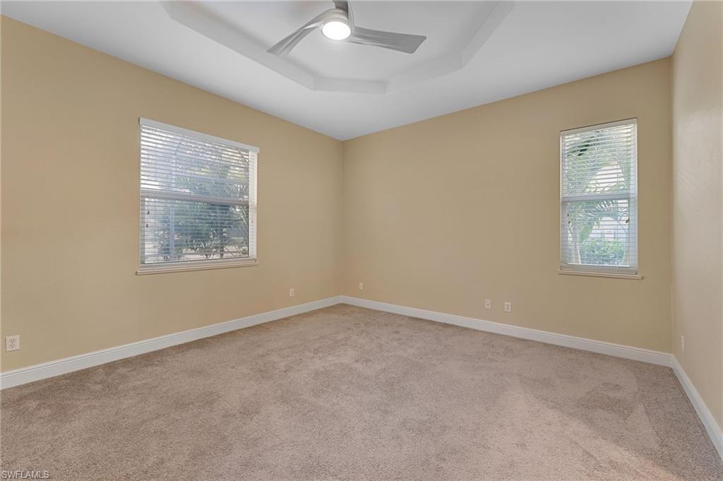 15322 Cortona Way Naples, FL 34120 - Photo 6 of 26 an empty room with windows