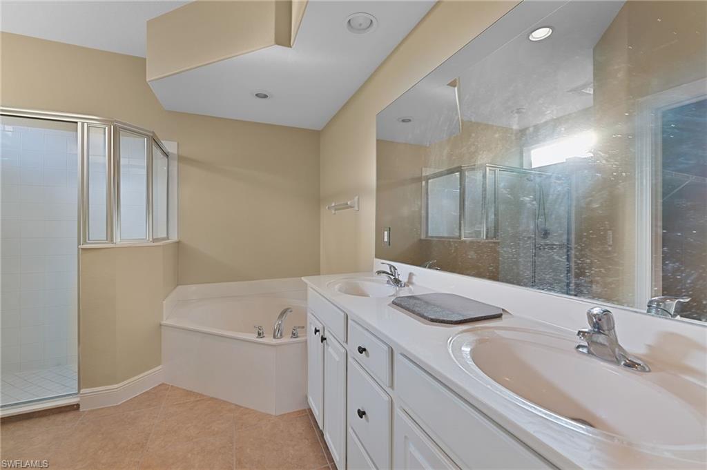 15322 Cortona Way Naples, FL 34120 - Photo 8 of 26 a bathroom with a granite countertop sink mirror and double