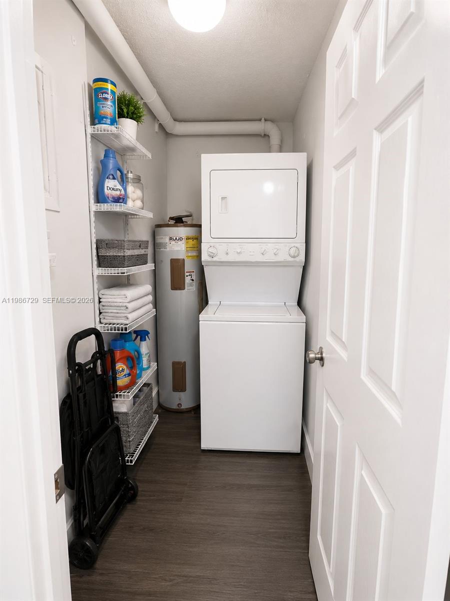 299 Northwest 52nd Terrace, Unit PHX Boca Raton, FL 33487 - Photo 12 of 16 a utility room with dryer and washer