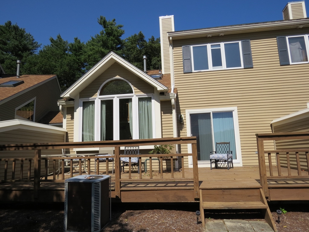 5 B Pond View Way, Unit 5B Northborough, MA 01532 - Photo 1 of 16 a front view of a house with a yard