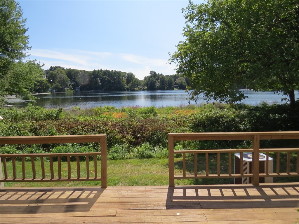 5 B Pond View Way, Unit 5B Northborough, MA 01532 - Photo 2 of 16 a view of a wooden deck and lake