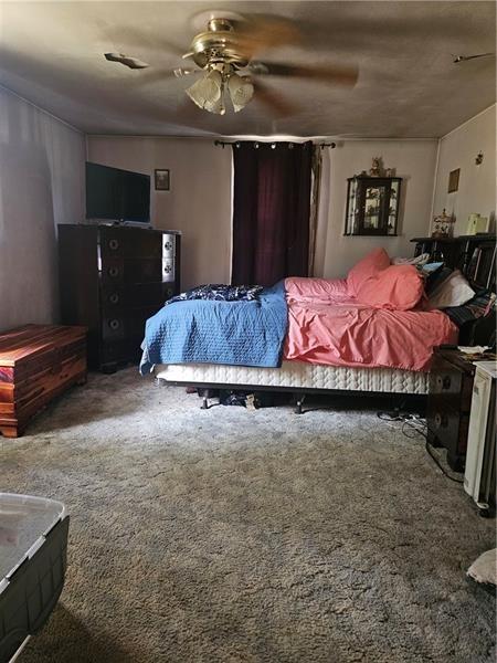 643 Joffre Bulger Road Bulger, PA 15019 - Photo 11 of 22 a bed room with a bed and a ceiling fan