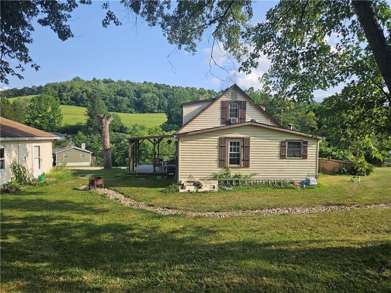 643 Joffre Bulger Road Bulger, PA 15019 - Photo 3 of 22 a view of backyard of house with green space
