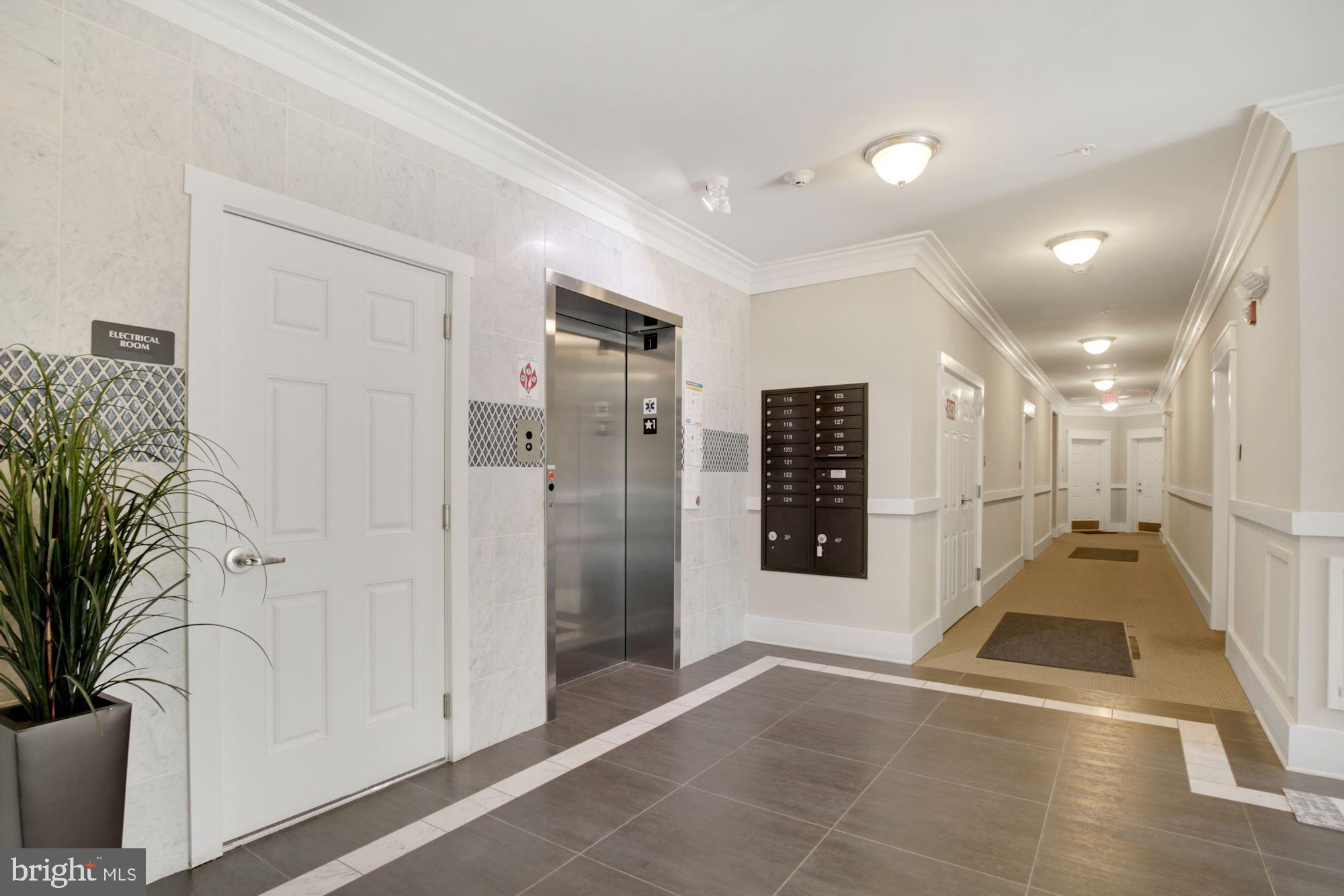 3825 Doc Berlin Drive, Unit 17 Silver Spring, MD 20906 - Photo 31 of 34 a view of a hallway with wooden floor