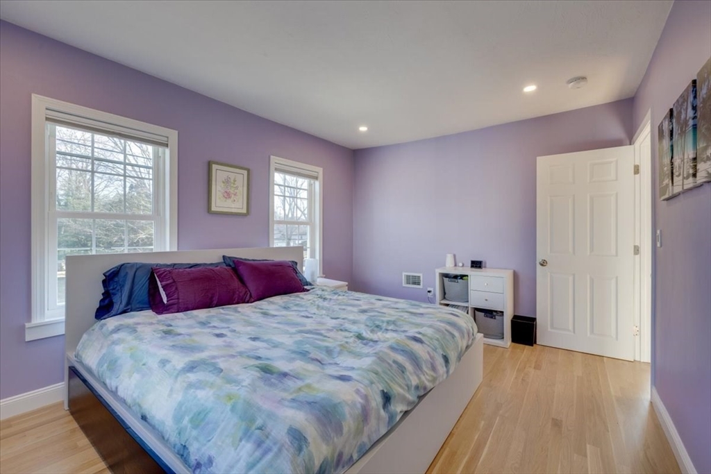 1 Bennett Street Natick, MA 01760 - Photo 11 of 28 a bedroom with a large bed and a window