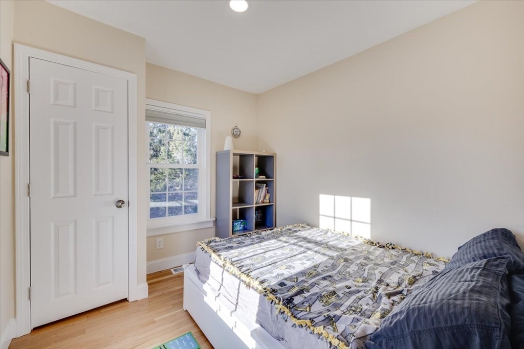 1 Bennett Street Natick, MA 01760 - Photo 13 of 28 a living room with a bed furniture and a window