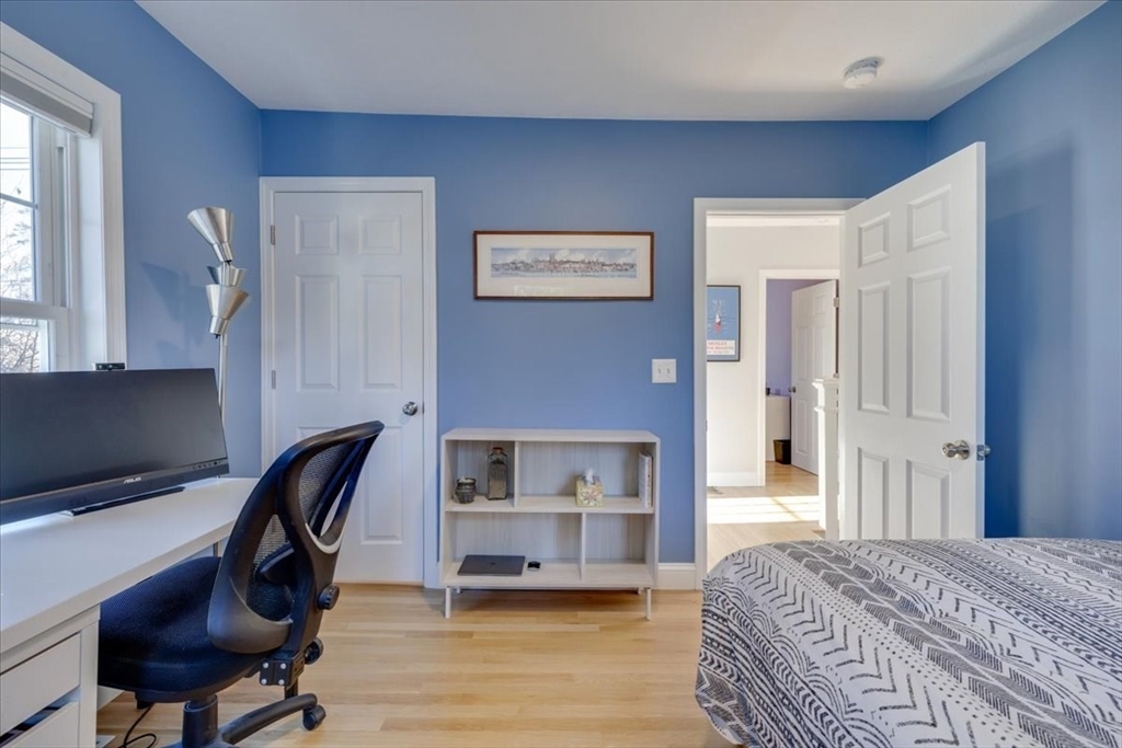 1 Bennett Street Natick, MA 01760 - Photo 16 of 28 a bedroom with a bed and a chair