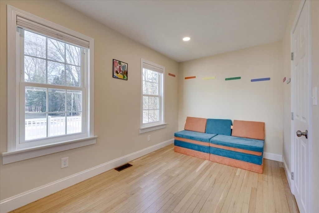 1 Bennett Street Natick, MA 01760 - Photo 17 of 28 a living room with furniture and a window