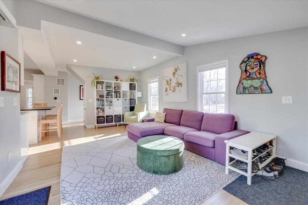 1 Bennett Street Natick, MA 01760 - Photo 2 of 28 a living room with furniture and a wooden floor