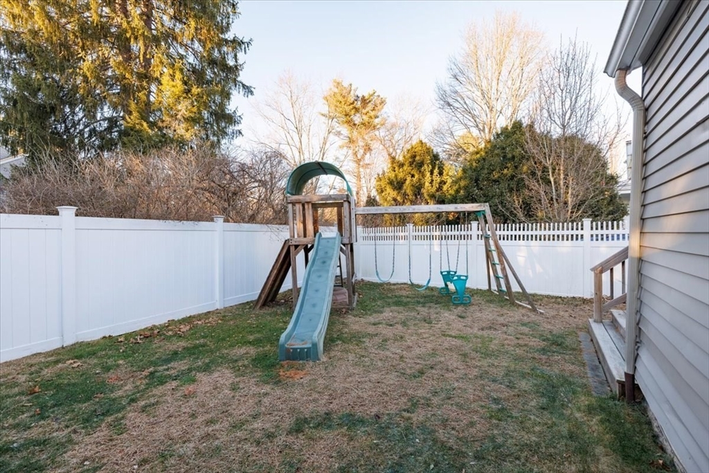1 Bennett Street Natick, MA 01760 - Photo 26 of 28 a view of a backyard with a tree