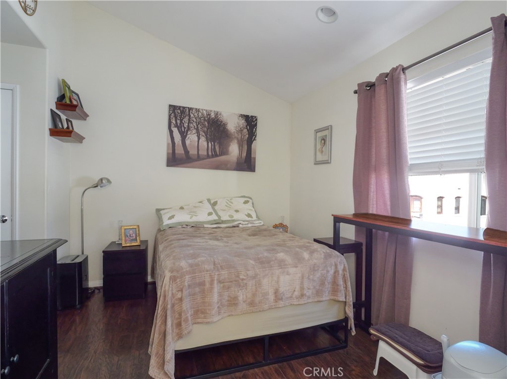 1323 Post Avenue, Unit K Torrance, CA 90501 - Photo 11 of 23 a bedroom with a bed and a window